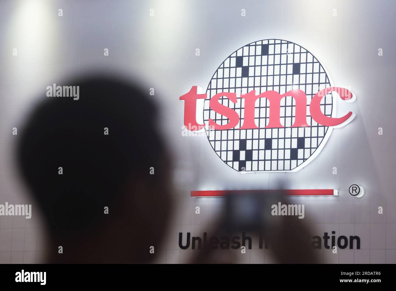 NANJING, CHINA - JULY 19, 2023 - Visitors visit the booth of TSMC at ...