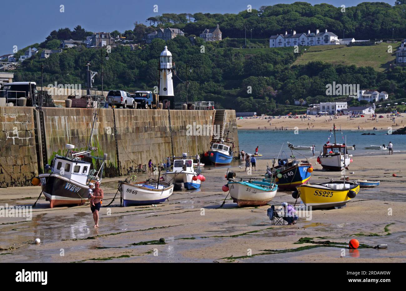 Looking east towards Carbis Bay, Boats moored at St Ives harbour, Cornwall Kernow , South West England, UK, TR26 1PU Stock Photo