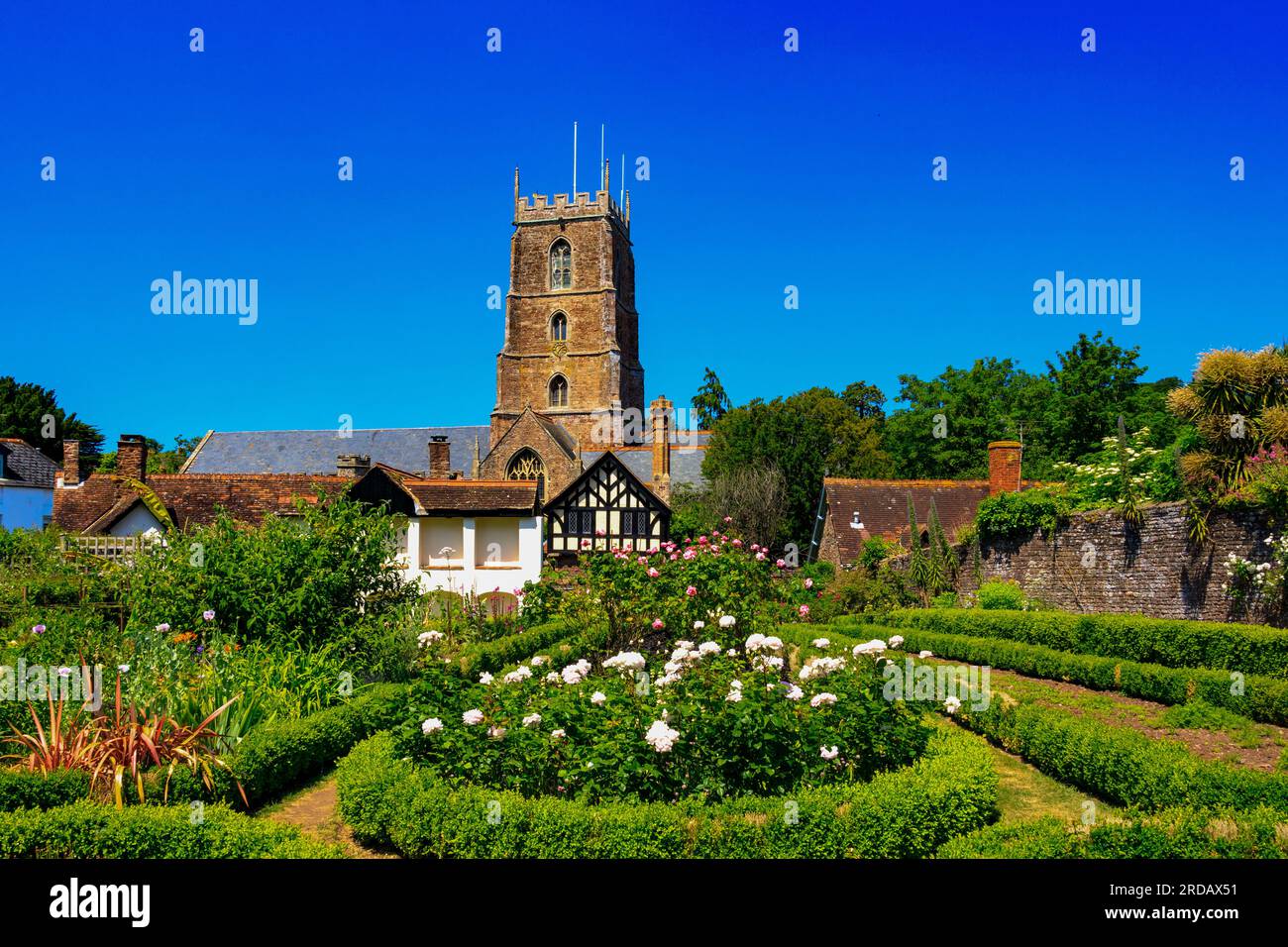 Dunster parish church of St viewed from the Dream Garden at