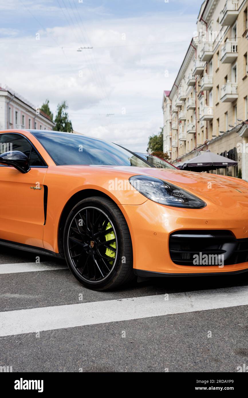 Minsk, Belarus, July 2023 - Colorful Porsche sport car in parking lot. modern supercar Stock Photo
