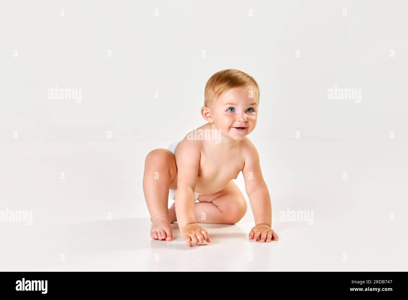 little child girl in dress sitting on the floor with confetti Stock Photo -  Alamy