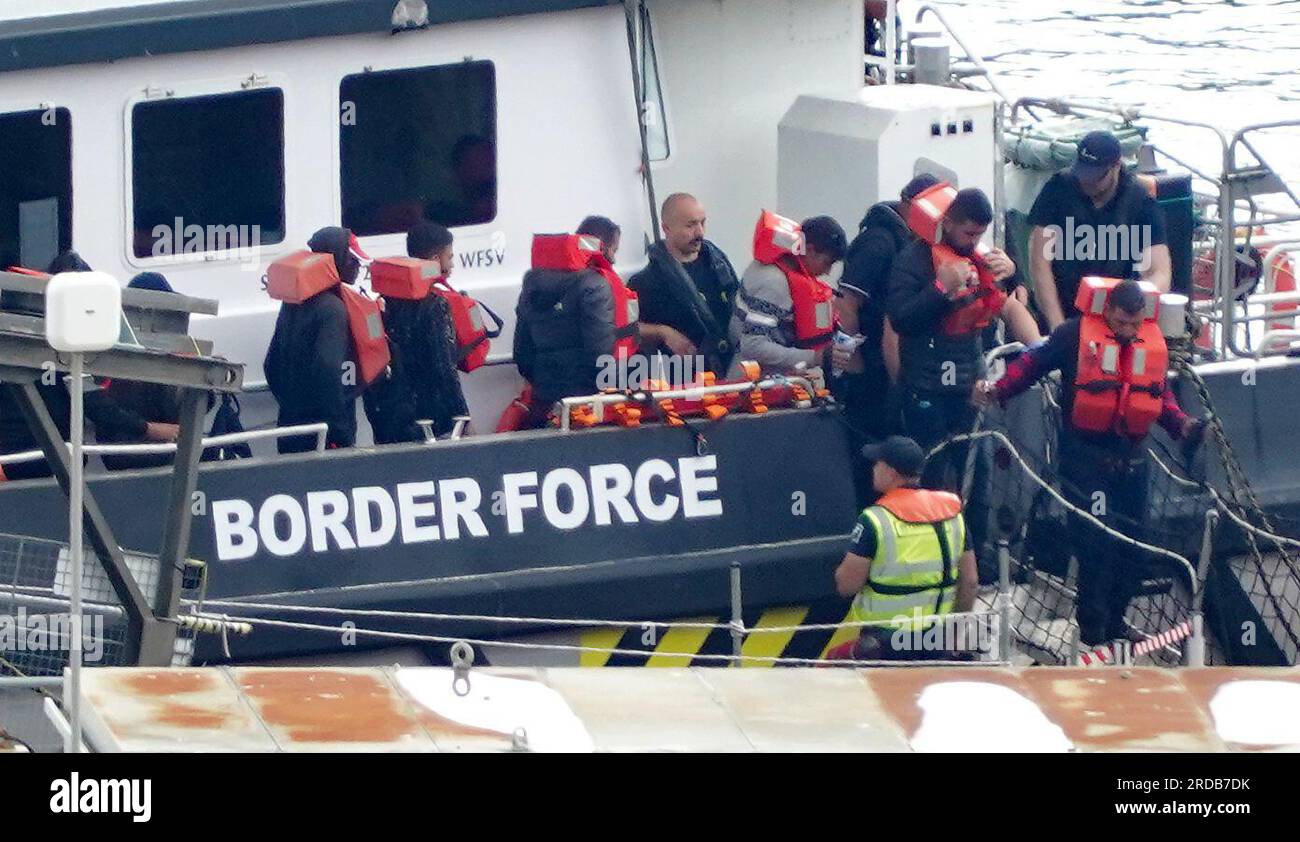 A group of people thought to be migrants are brought in to Dover, Kent ...
