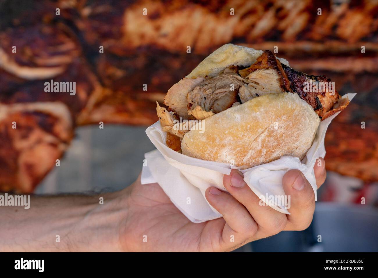 famous traditional portugal pork sandwich called bifana to take away . Stock Photo