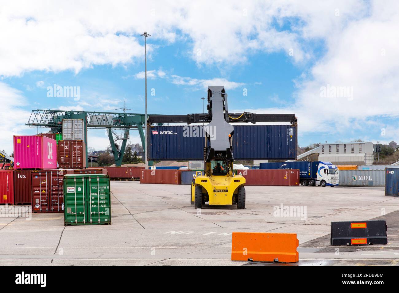Shipping Containers being loaded onto HGV Vehicle at an inland