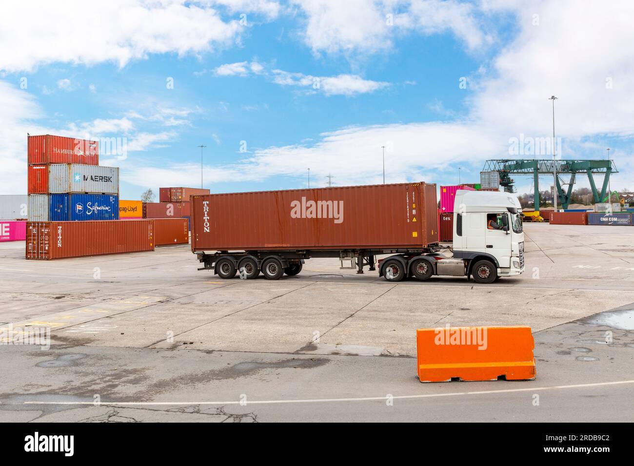 Shipping Containers being loaded onto HGV Vehicle at an inland