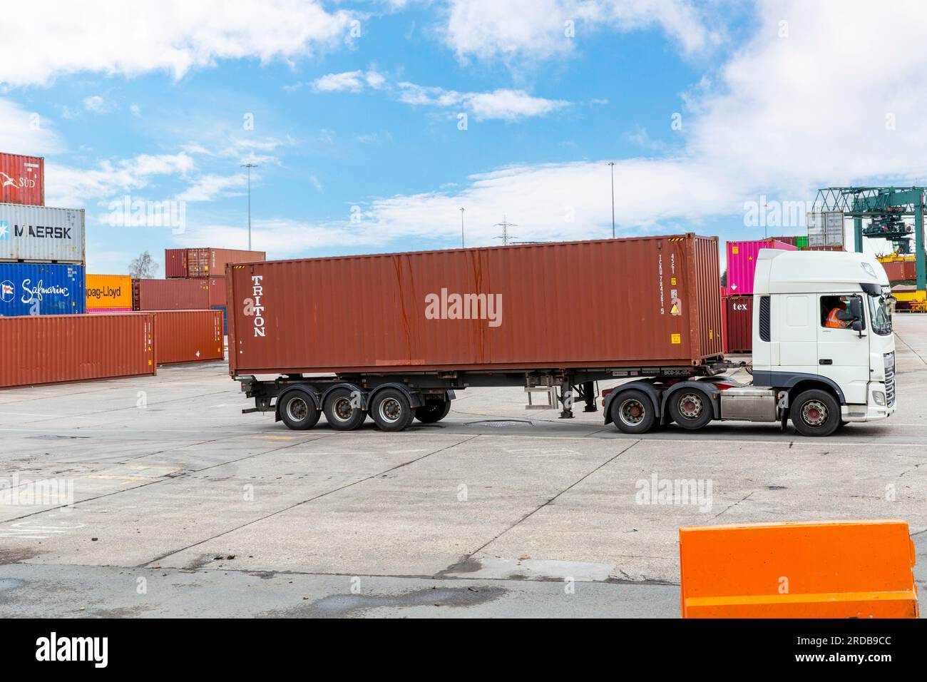 Shipping Containers being loaded onto HGV Vehicle at an inland ...