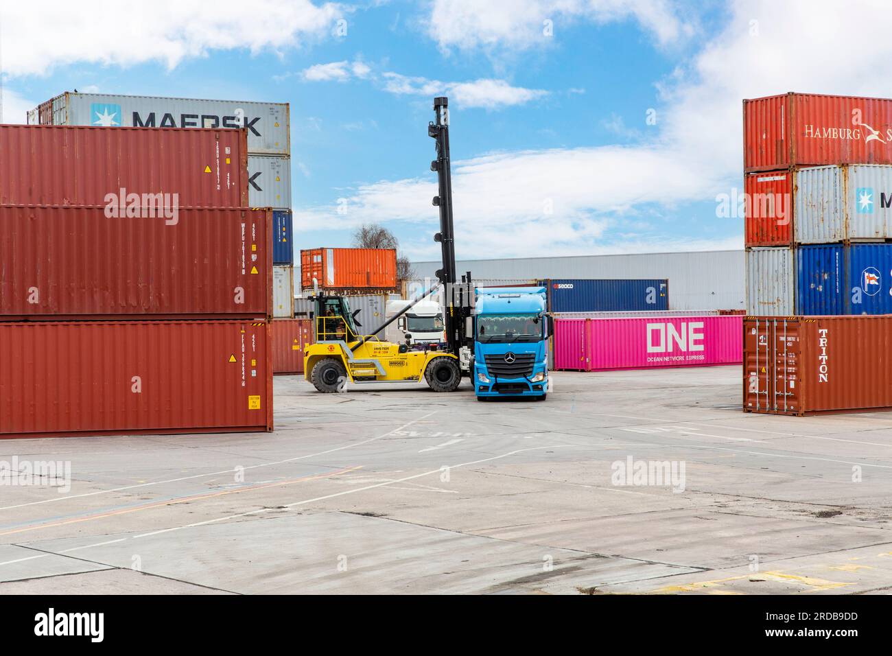 Shipping Containers being loaded onto HGV Vehicle at an inland