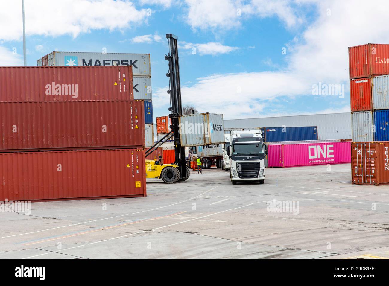 Shipping Containers being loaded onto HGV Vehicle at an inland