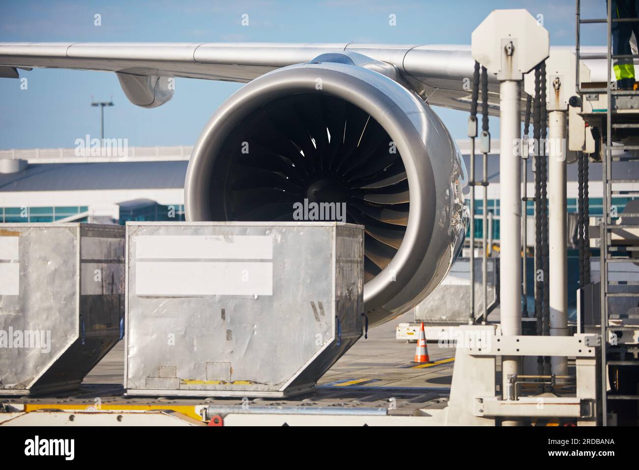 Preparation airplane at airport. Loading of cargo containers to plane