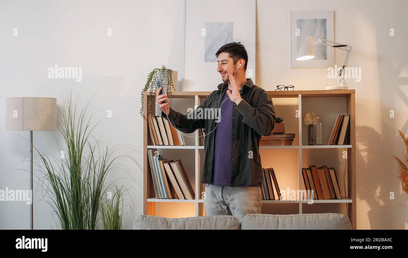 Video communication man headset smartphone home Stock Photo