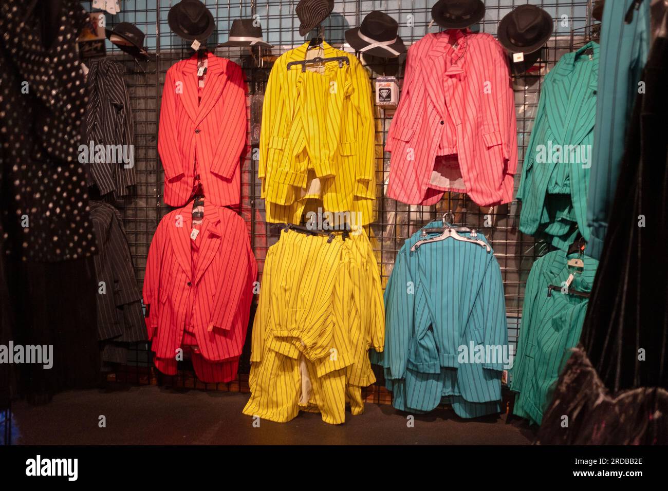 Colorful striped zoot suits for sale at the recently reopened Halloween Adventure costume & tchotchke shop in Greenwich Village, Manhattan. Stock Photo