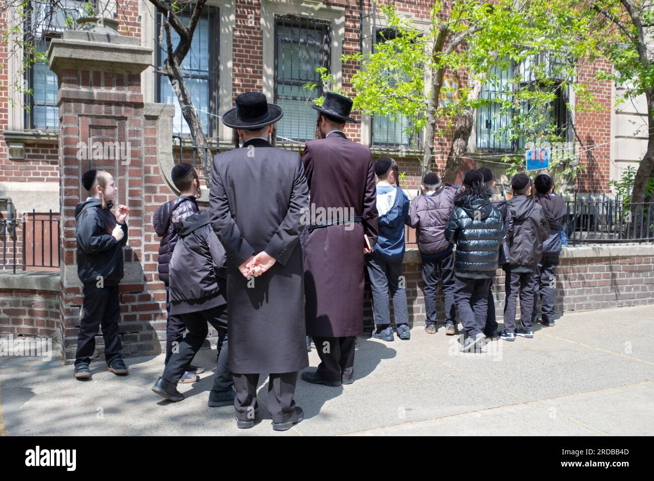 Jewish yeshiva students their rabbi make a blessing for newly budding
