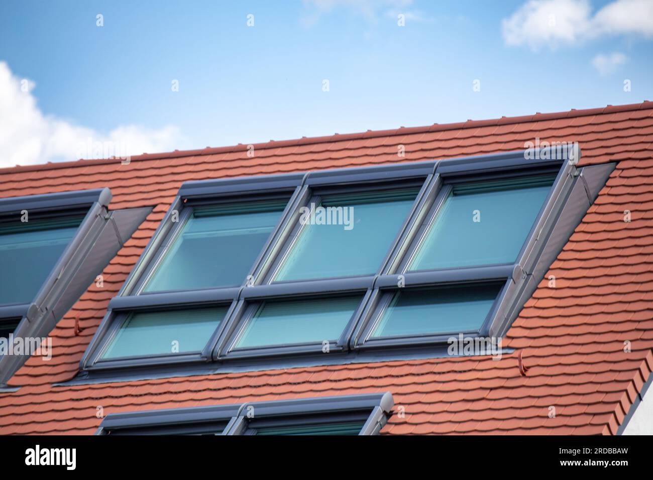 Newly tiled roof with large skylight windows Stock Photo Alamy