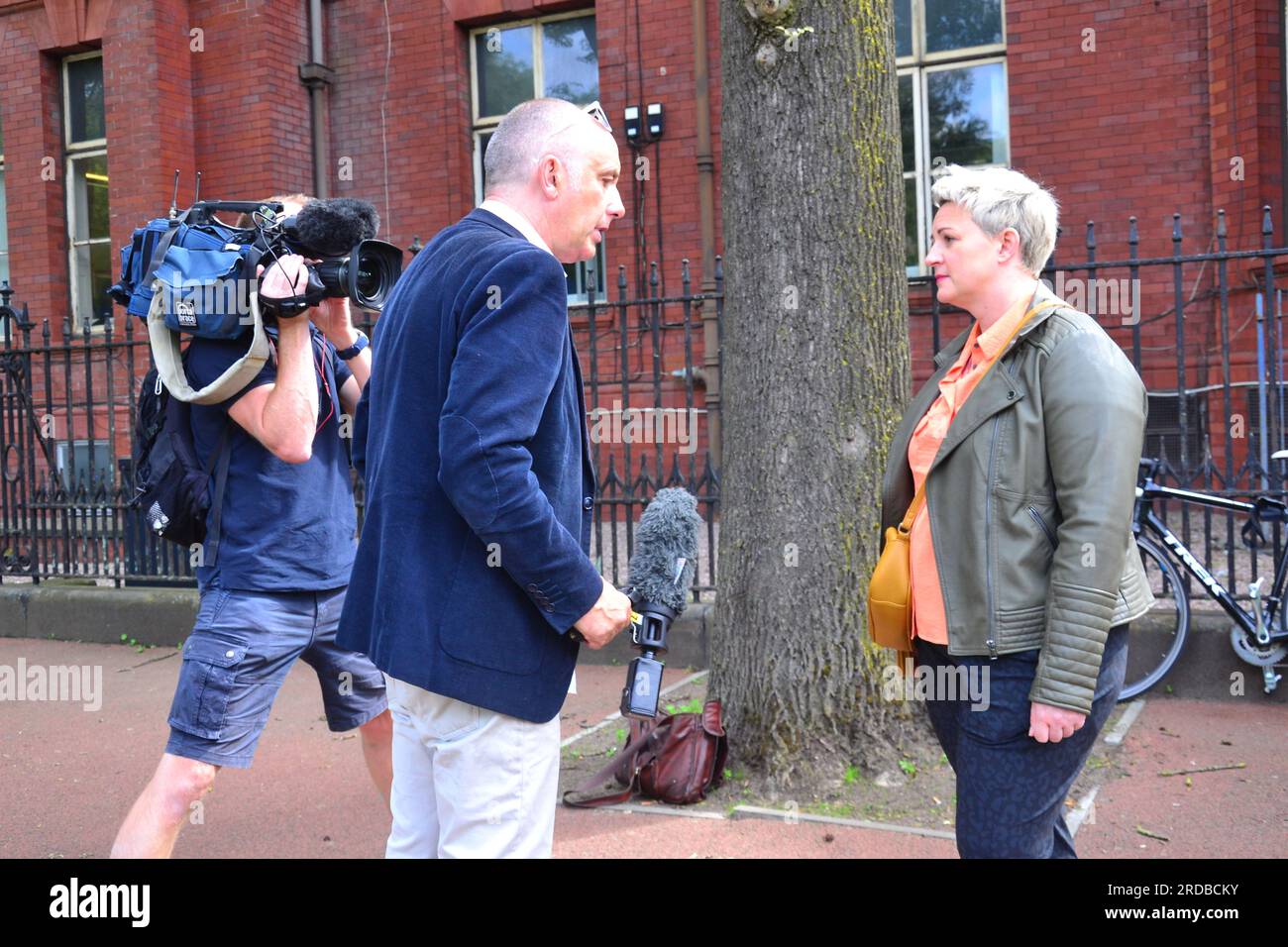Manchester, UK. 20th July, 2023. A TV crew interviews one of the striking consultants. Senior NHS doctors picket a hospital on Oxford Road outside Manchester Royal Infirmary, Manchester, UK. Pictured at 10.28 am local time. Senior NHS doctors started a 48 hour strike from 20th July, 2023, to 22nd July to lobby for a pay rise. Thousands of senior NHS doctors are striking across the country today, the first of this type in over ten years. This includes consultant doctors and dentists in hospitals. Critics say this will cause great disruption to patients. Credit: Terry Waller/Alamy Live News Stock Photo