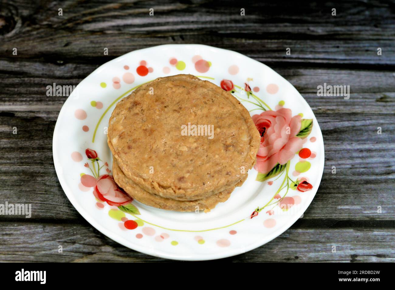 Raw uncooked beef burger ready to be cooked and fried in shallow oil