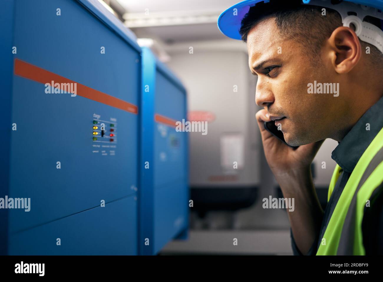 Phone call, man and check with engineer on power box, control room or technician with switchboard or maintenance on generator. Electrician Stock Photo