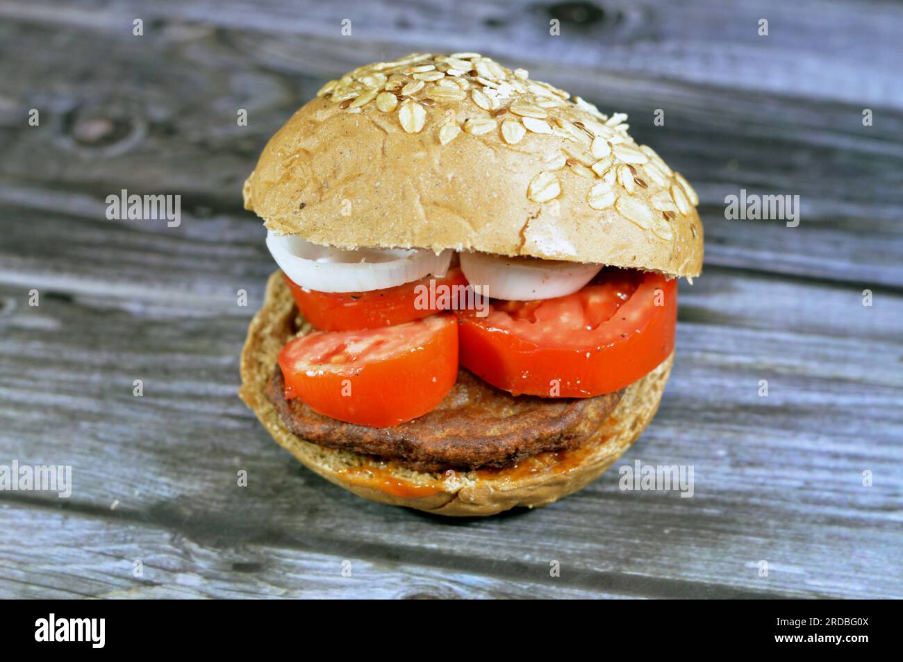 spicy fried beef burger cooked in a boiling shallow oil with slices of