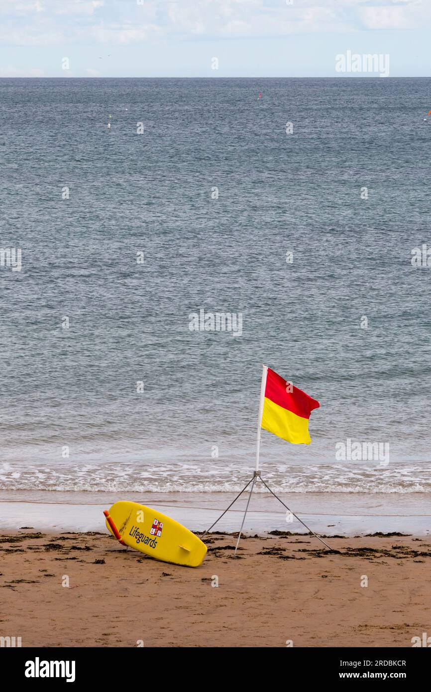 Life Guard safe beach flag and rescue flote Whitley Bay Stock Photo Alamy