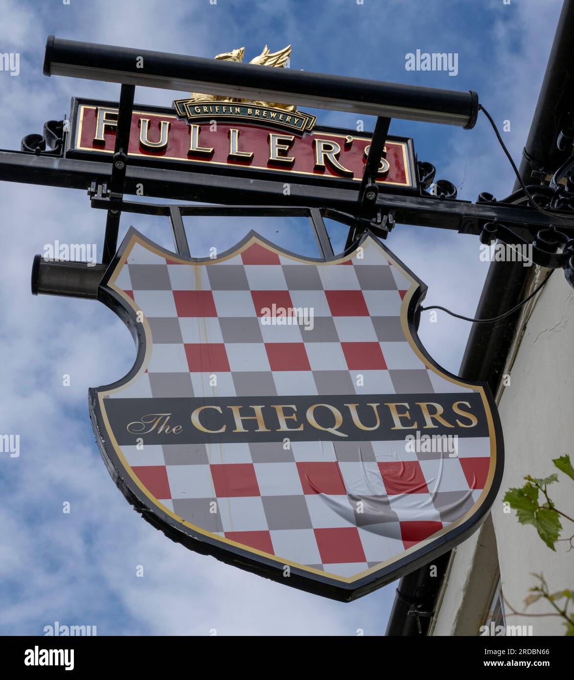 Traditional hanging pub sign at The Chequers a Fuller's public house, Goddards Lane, Chipping Norton, Oxfordshire, England, UK Stock Photo