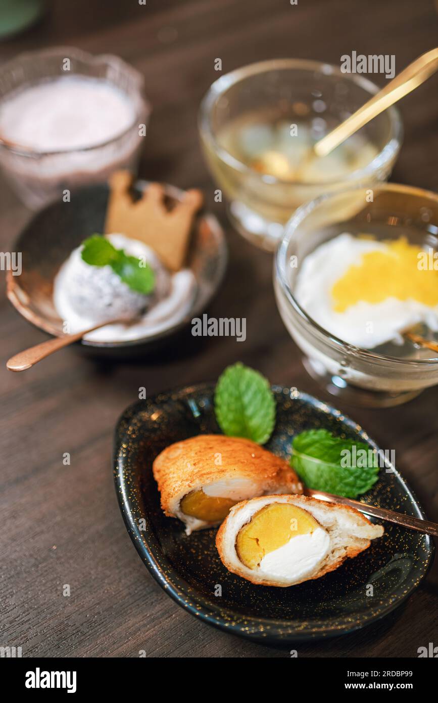 The dessert with sweet white cream Egg Yolk Stock Photo - Alamy
