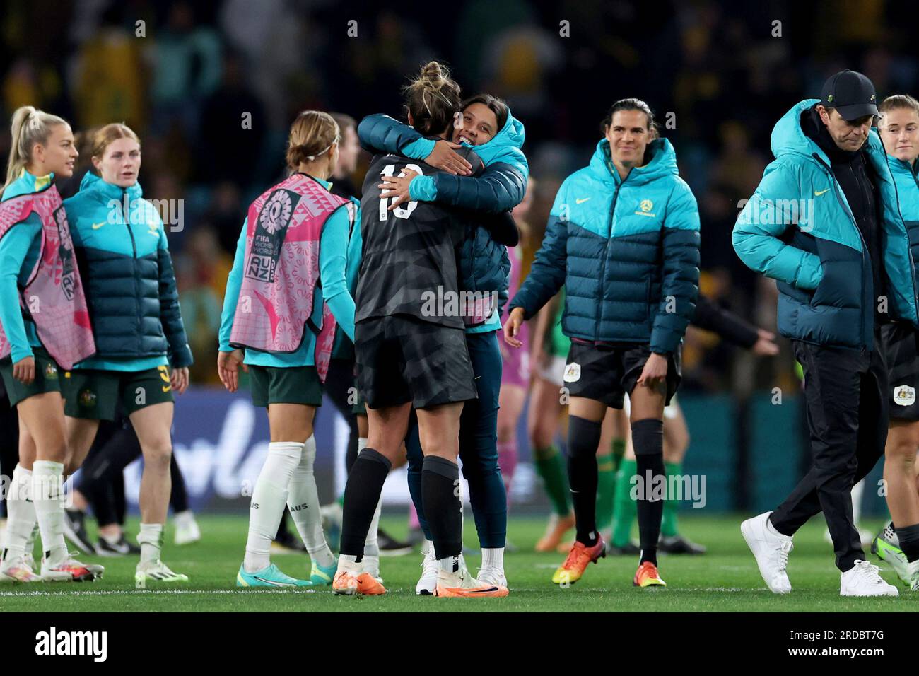Australia's Sam Kerr, facing the camera, hugs teammate goalkeeper
