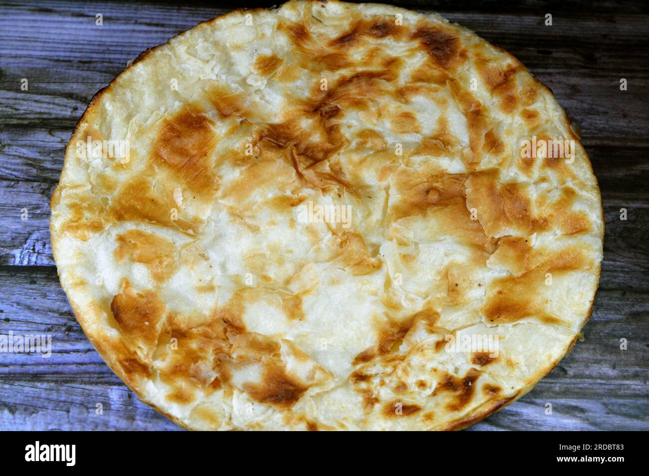 Egyptian Feteer meshaltet, layers upon layers of pastry dough with loads of ghee or butter in between, one of the famous Egyptian pastry recipes, a fl Stock Photo