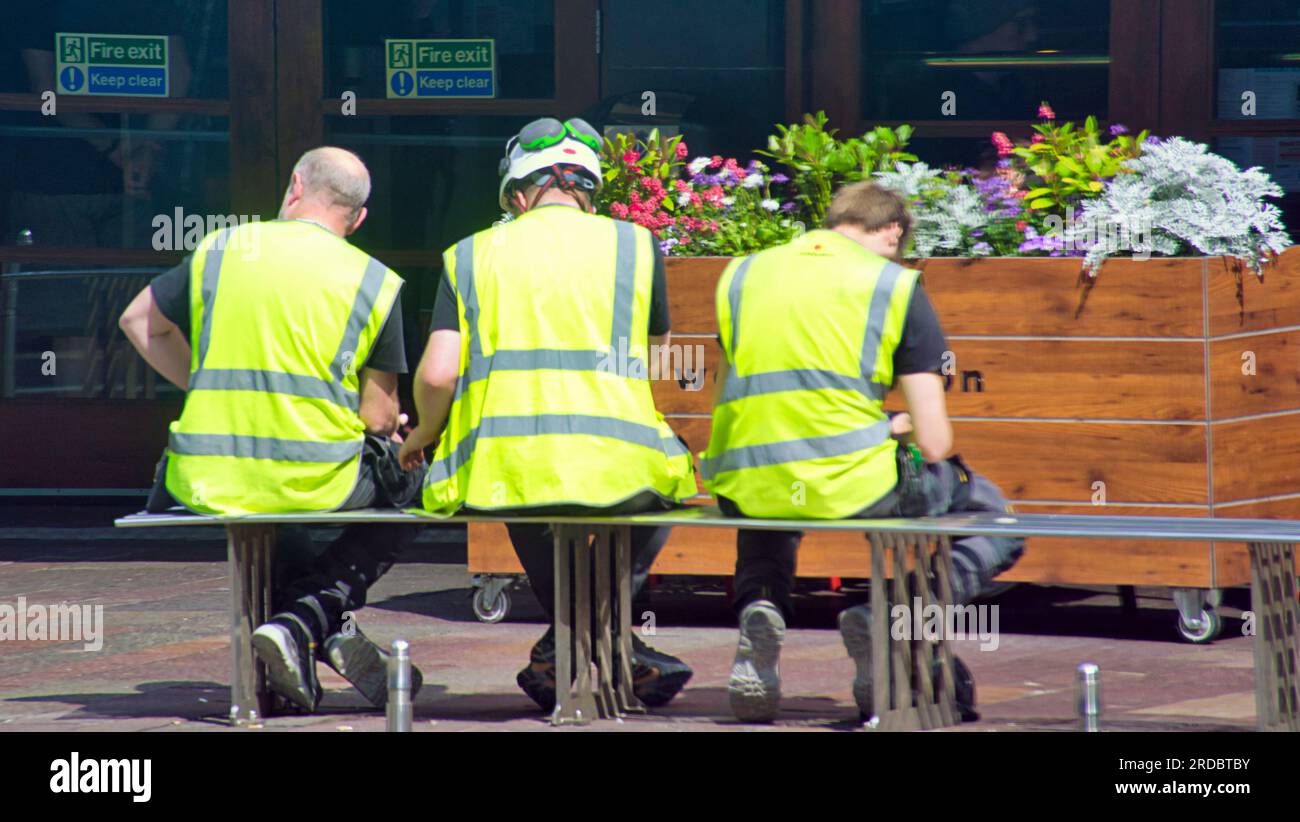 people make glasgow workers in yellow vests Stock Photo