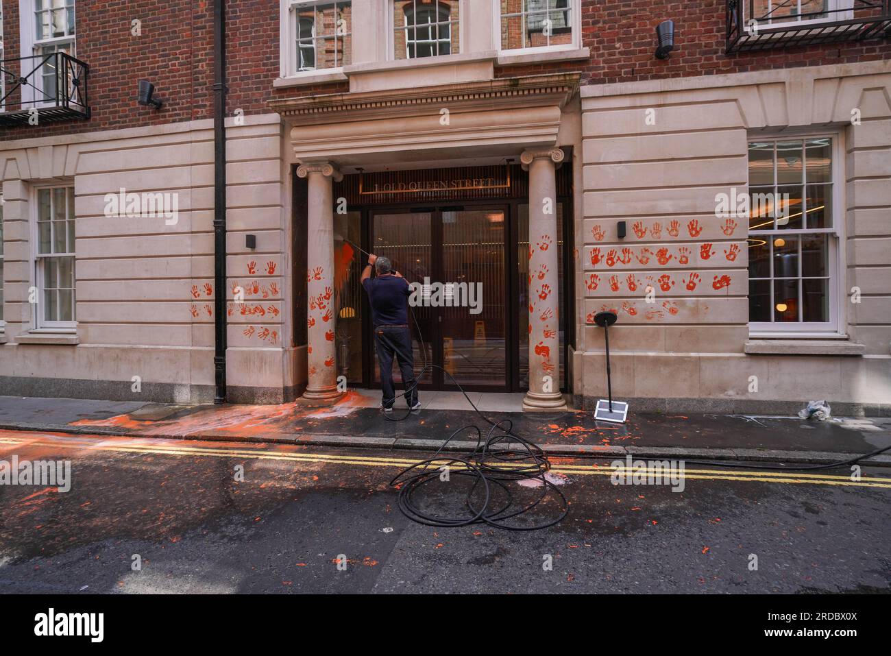 London UK. 20 July 2023  The orange paint  is washed off the exterior  of  the headquarters  of the Policy Exchange  after it was targeted by Just Stop Oil climate activists today . Policy Exchange  is an oil funded  British conservative think tank based in London which  has reportedly helped write anti protest laws targeting climate activists. Just Stop Oil have demanded an end to all new fossil fuel licences and cease new investments in oil, gas and coal .Credit amer ghazzal/Alamy Live News Stock Photo