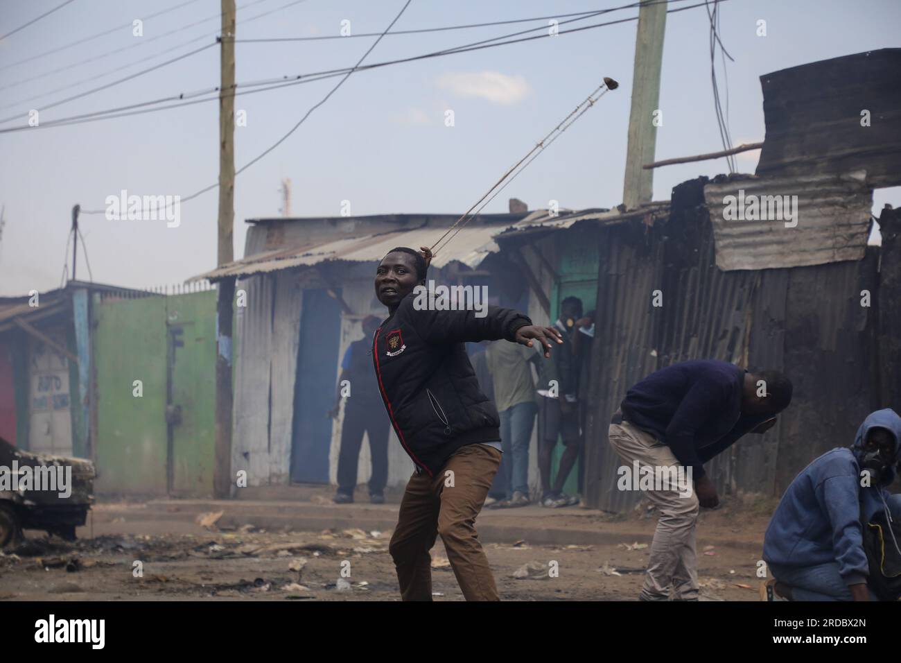 Nairobi, Kenya. 20th July, 2023. A protester uses a slingshot to throw