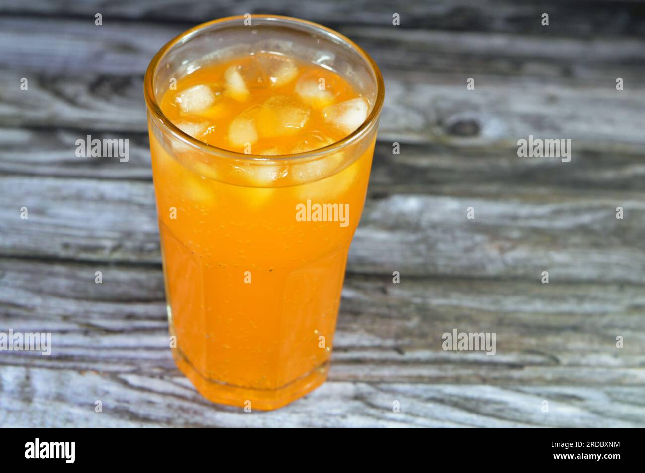 Orange soft drink with ice, orange pop soda, orangeade, carbonated