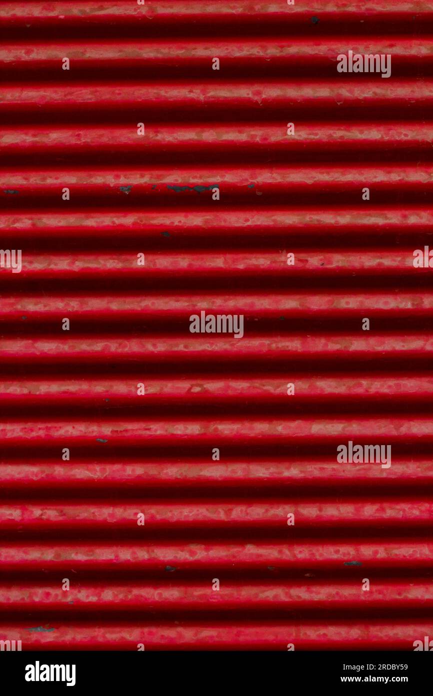 Closed red color,aluminum shutter of the building,backgrounds.Vertical ...