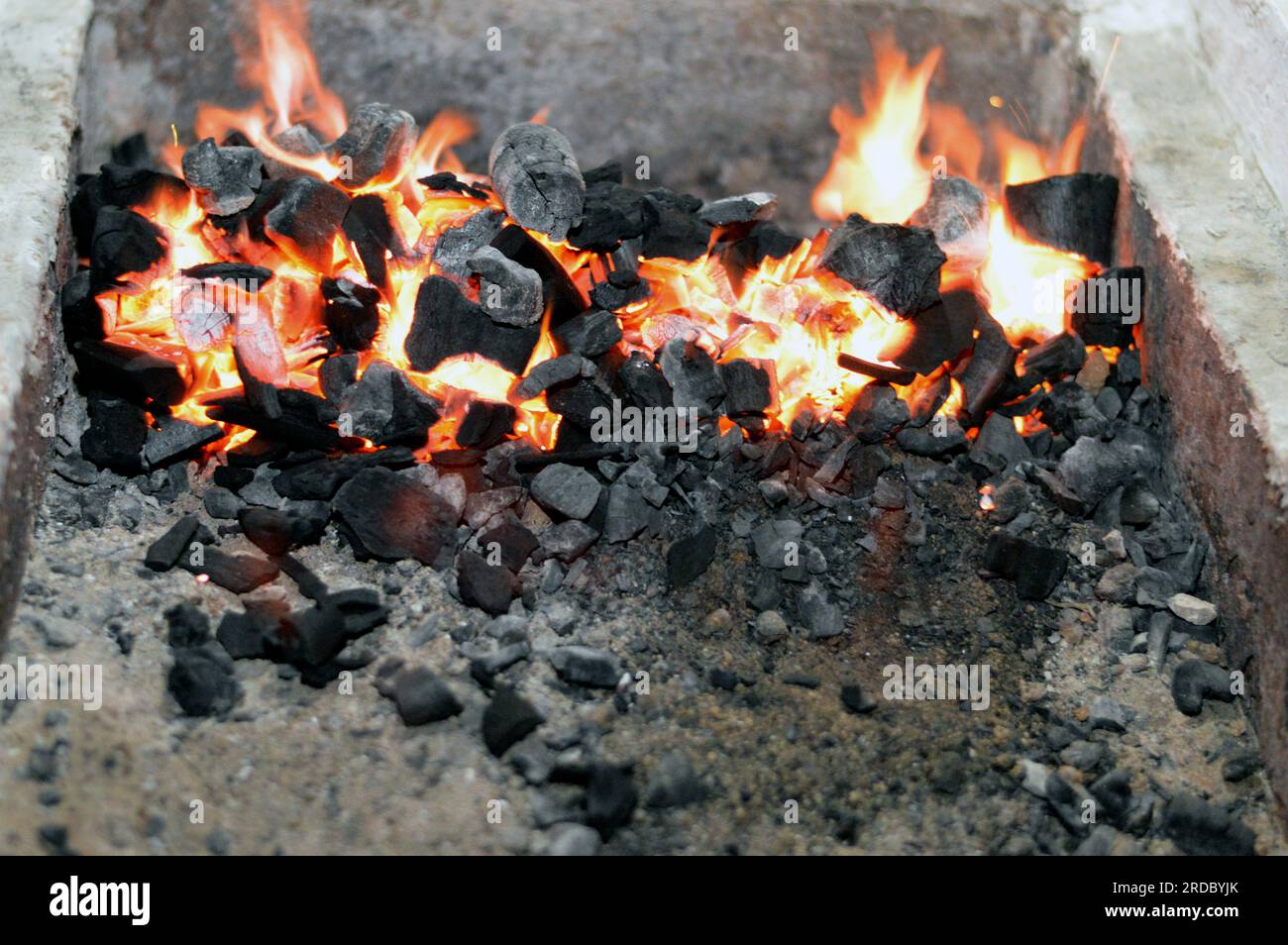 A charcoal fire in a Charcoal kettle grilling usually used for grilling meat and marinated beef meat on skewers like kebab and kofta kufta in middle e Stock Photo