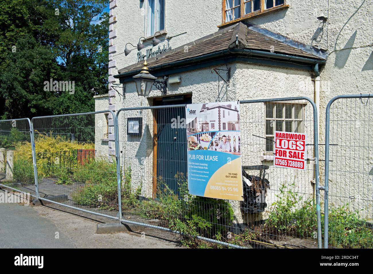 The Wharfedale pub, closed and fenced off, with pub for lease sign, in Arthington, West Yorkshire, England UK Stock Photo