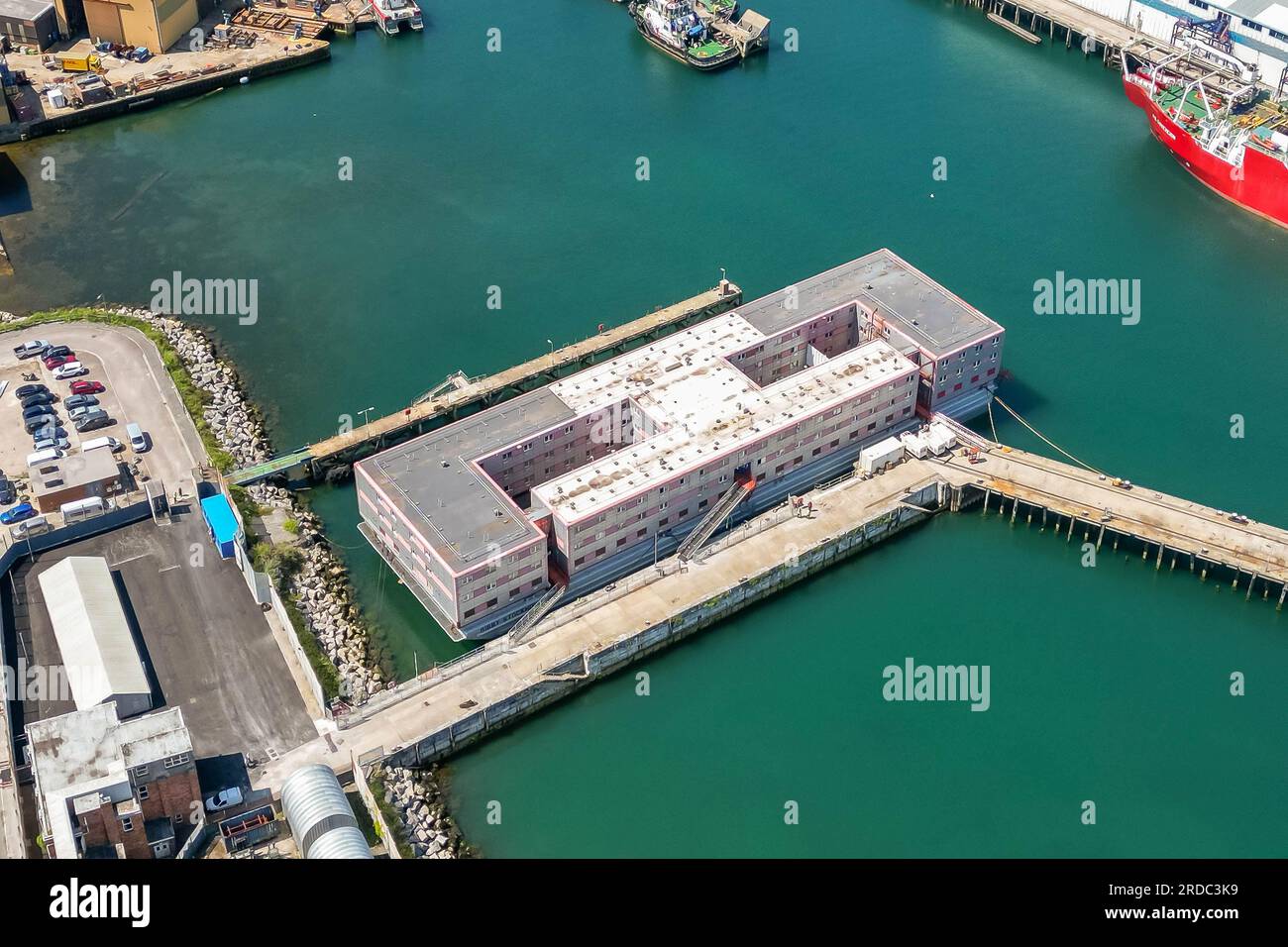 Portland, Dorset, UK.  20th July 2023.  Aerial view of the accommodation barge the Bibby Stockholm at its dock at Portland Port near Weymouth in Dorset, where it will house up to 500 asylum seekers for the next 18 months.  It arrived on Tuesday morning and is being prepared to receive the first asylum seekers which are due to arrive next week.  Picture Credit: Graham Hunt/Alamy Live News Stock Photo