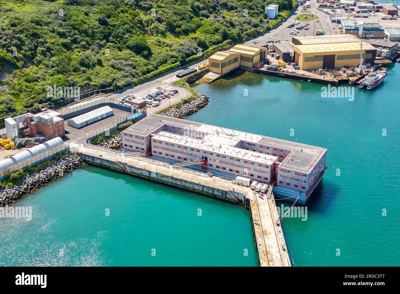 Portland, Dorset, UK.  20th July 2023.  Aerial view of the accommodation barge the Bibby Stockholm at its dock at Portland Port near Weymouth in Dorset, where it will house up to 500 asylum seekers for the next 18 months.  It arrived on Tuesday morning and is being prepared to receive the first asylum seekers which are due to arrive next week.  Picture Credit: Graham Hunt/Alamy Live News Stock Photo