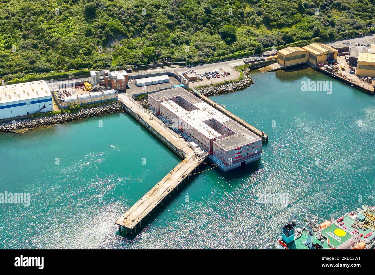 Portland, Dorset, UK.  20th July 2023.  Aerial view of the accommodation barge the Bibby Stockholm at its dock at Portland Port near Weymouth in Dorset, where it will house up to 500 asylum seekers for the next 18 months.  It arrived on Tuesday morning and is being prepared to receive the first asylum seekers which are due to arrive next week.  Picture Credit: Graham Hunt/Alamy Live News Stock Photo