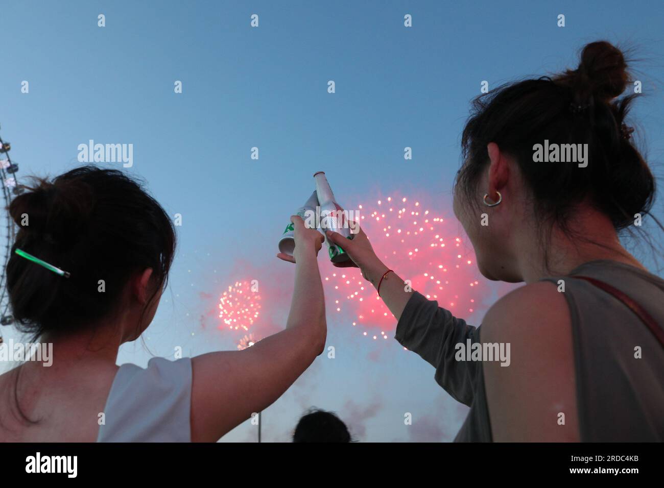 Harbin, China's Heilongjiang Province. 20th July, 2023. Visitors watch a fireworks show at the 21th China Harbin International Beer Festival in Harbin, capital of northeast China's Heilongjiang Province, July 20, 2023. The 21th China Harbin International Beer Festival opened here on Thursday. Credit: Zhang Tao/Xinhua/Alamy Live News Stock Photo