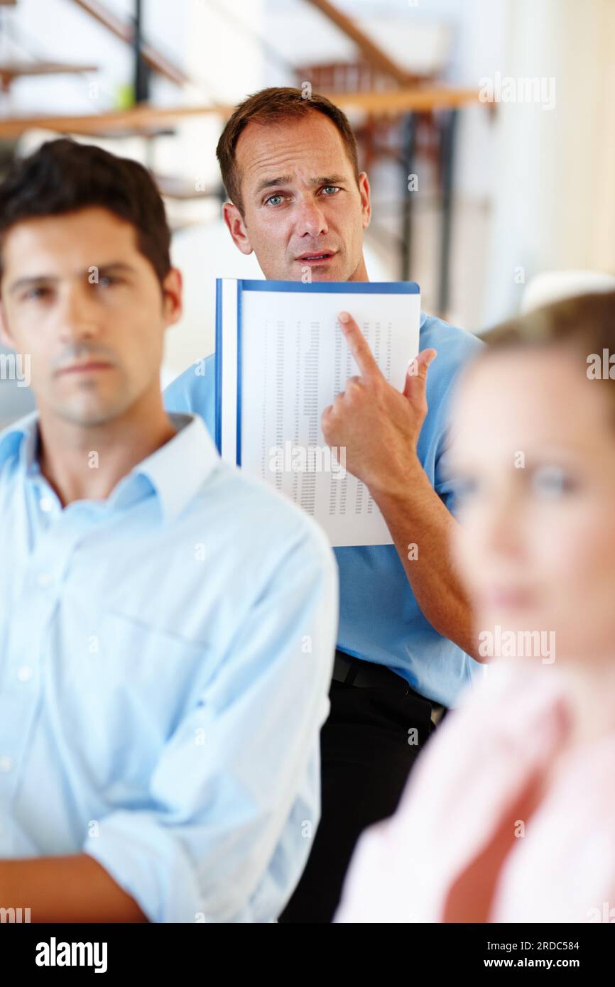 Seated casual man pointing hi-res stock photography and images - Alamy