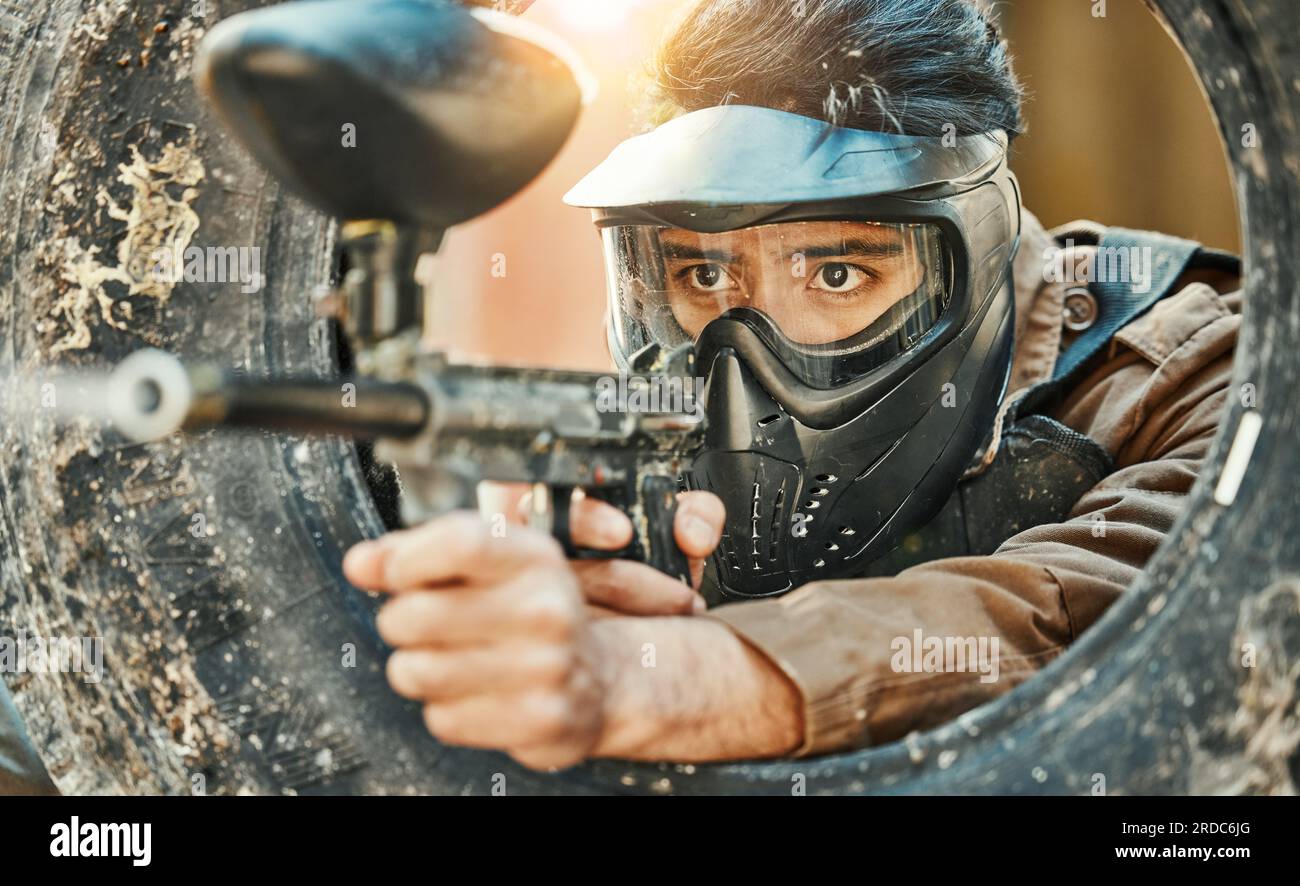 Paintball, shooting and man in action with gun for tournament, competition  and battle in nature. Camouflage, military and male person aim in outdoor  Stock Photo - Alamy