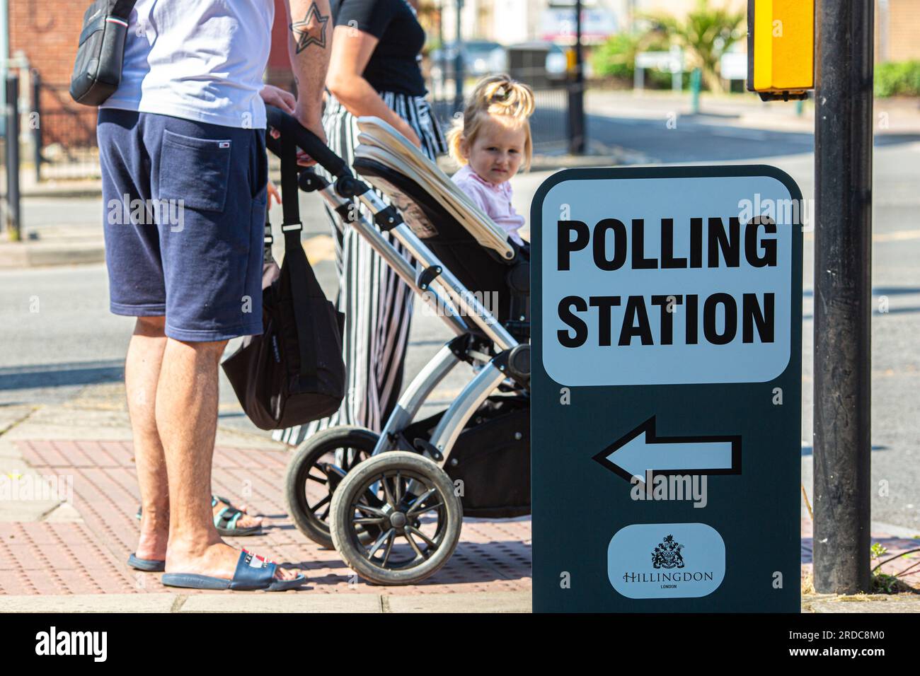 A family walks past a polling station in Yiewsley during a by-election in the northwest London constituency of Uxbridge and South Ruislip on July 20, 2023. Voters headed to the polls in three by-elections across England, with Prime Minister Rishi Sunak's ruling Conservatives braced for defeat in each as inflation-battered Britain's economic woes bite.Credit: Horst Friedrichs/Alamy Live Stock Photo