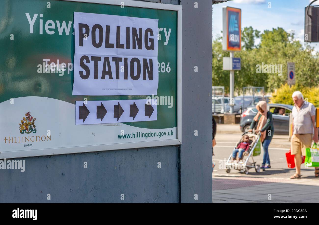 A pedestrian walks past a polling station in Yiewsley during a by-election in the northwest London constituency of Uxbridge and South Ruislip on July 20, 2023. Voters headed to the polls in three by-elections across England, with Prime Minister Rishi Sunak's ruling Conservatives braced for defeat in each as inflation-battered Britain's economic woes bite.Credit: Horst Friedrichs/Alamy Live Stock Photo