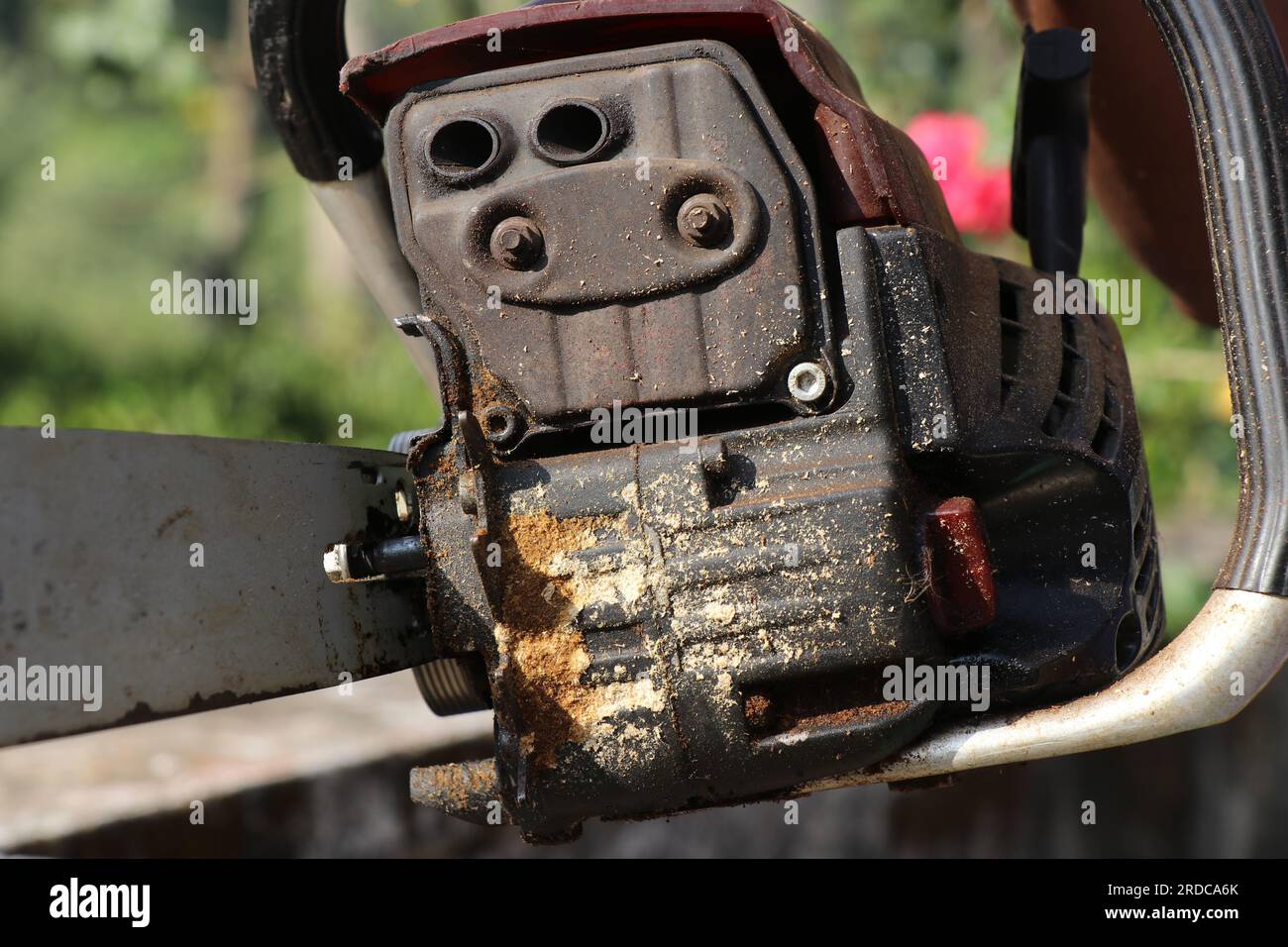 Chainsaw or a woodcutter machine with a view of the engine exhaust part
