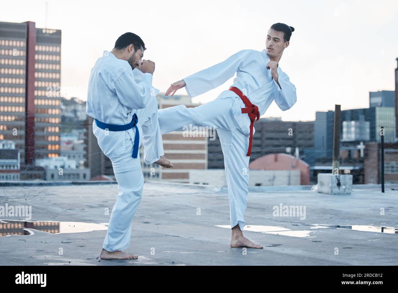 two men sparring with Filipino stick fighting martial arts Stock Photo