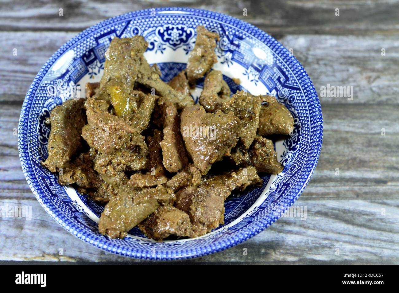 Grilled chicken liver sliced in pieces cooked with oil, white vinegar