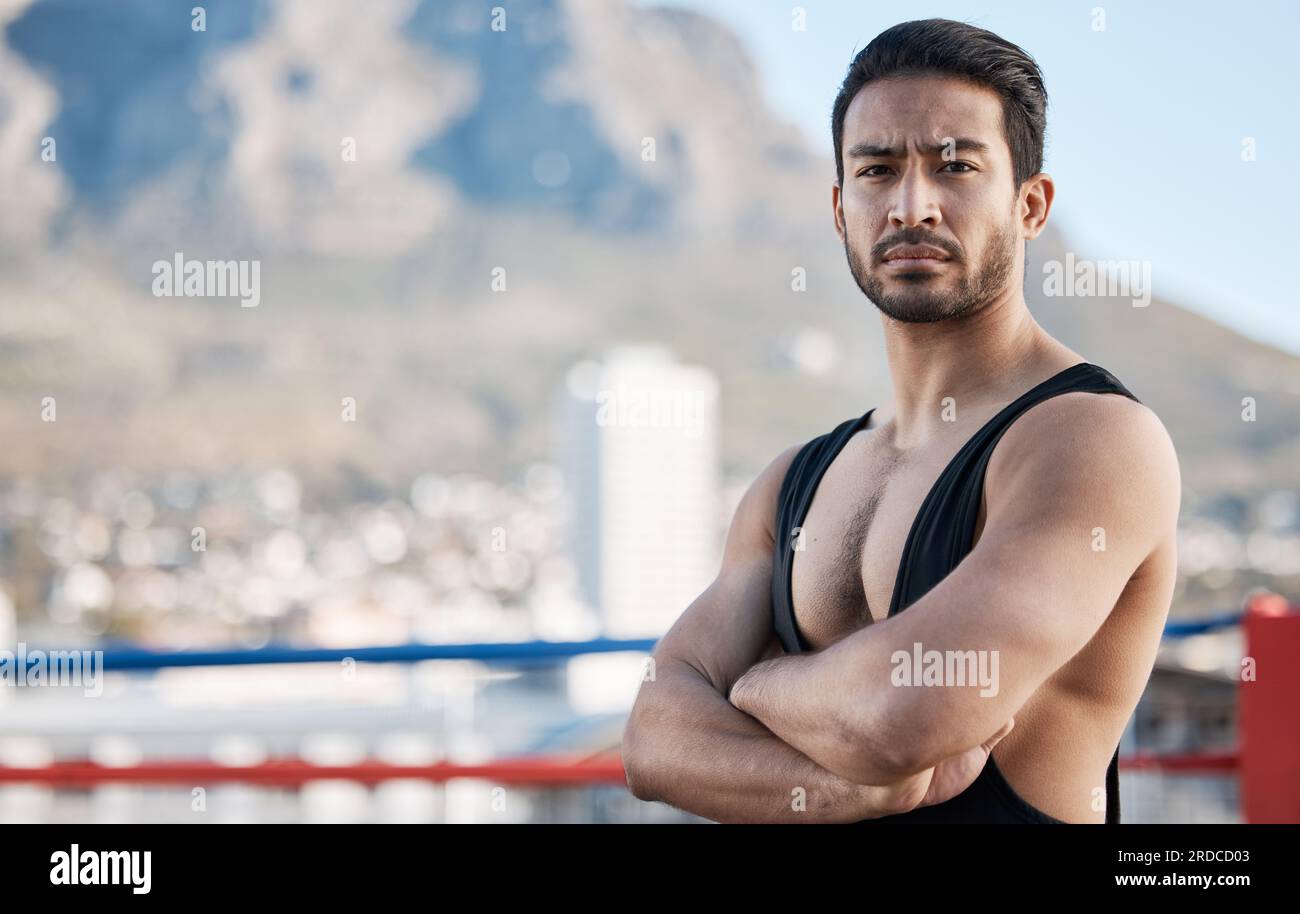 Man, wrestling and arms crossed in portrait for sport, ring and fitness