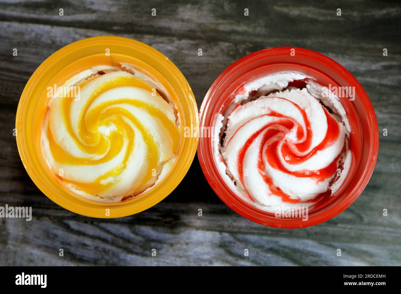 Mango and strawberry sauce ice cream frozen vanilla with fruit sauce