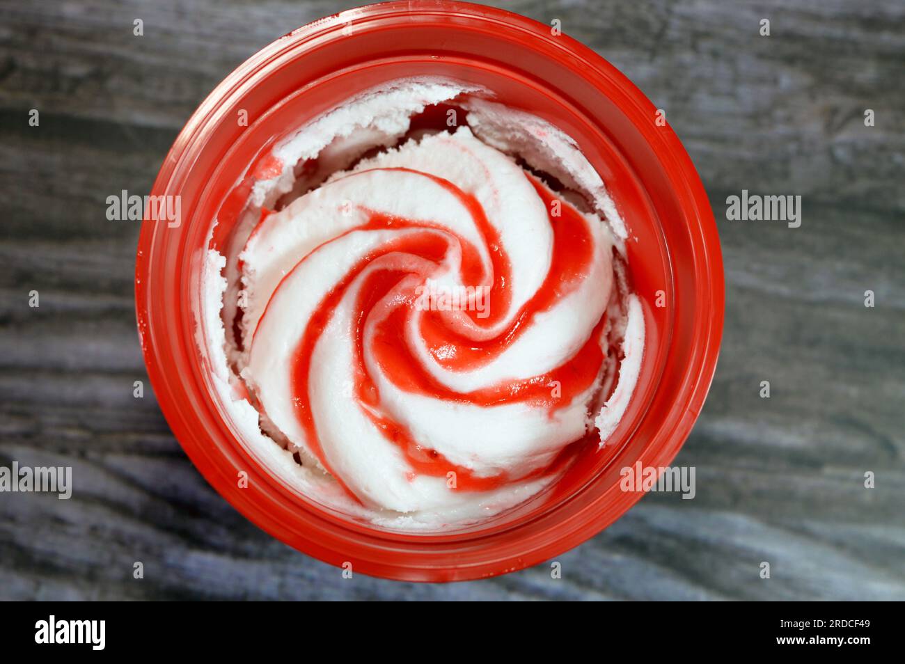 Strawberry sauce ice cream frozen vanilla with fruit sauce like mango