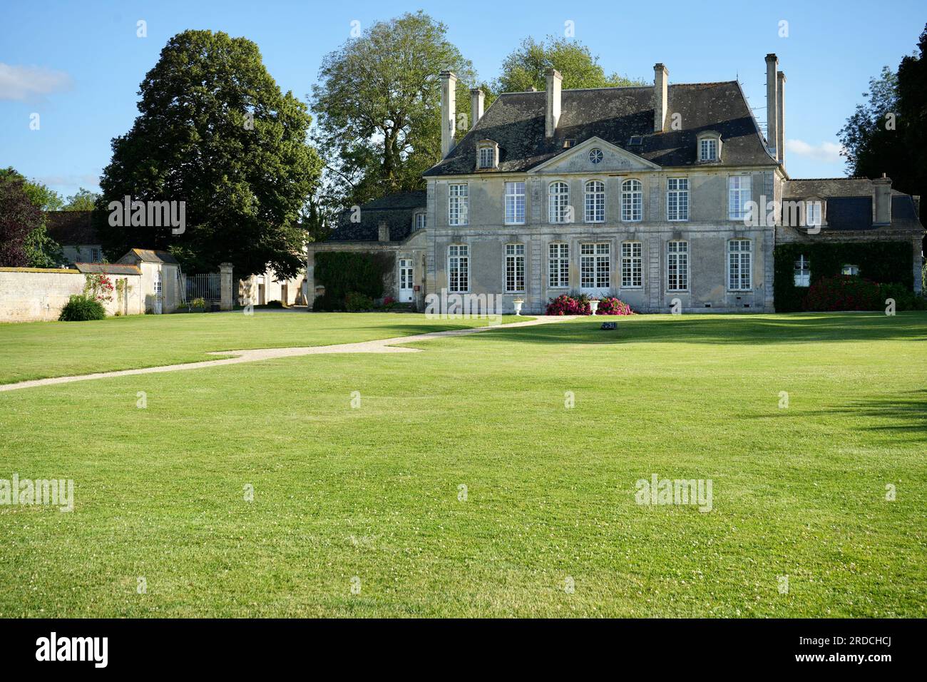Traditional French Chateau Buildings at Camping le Château de Martragny. Moulins en Bessin, France. Stock Photo