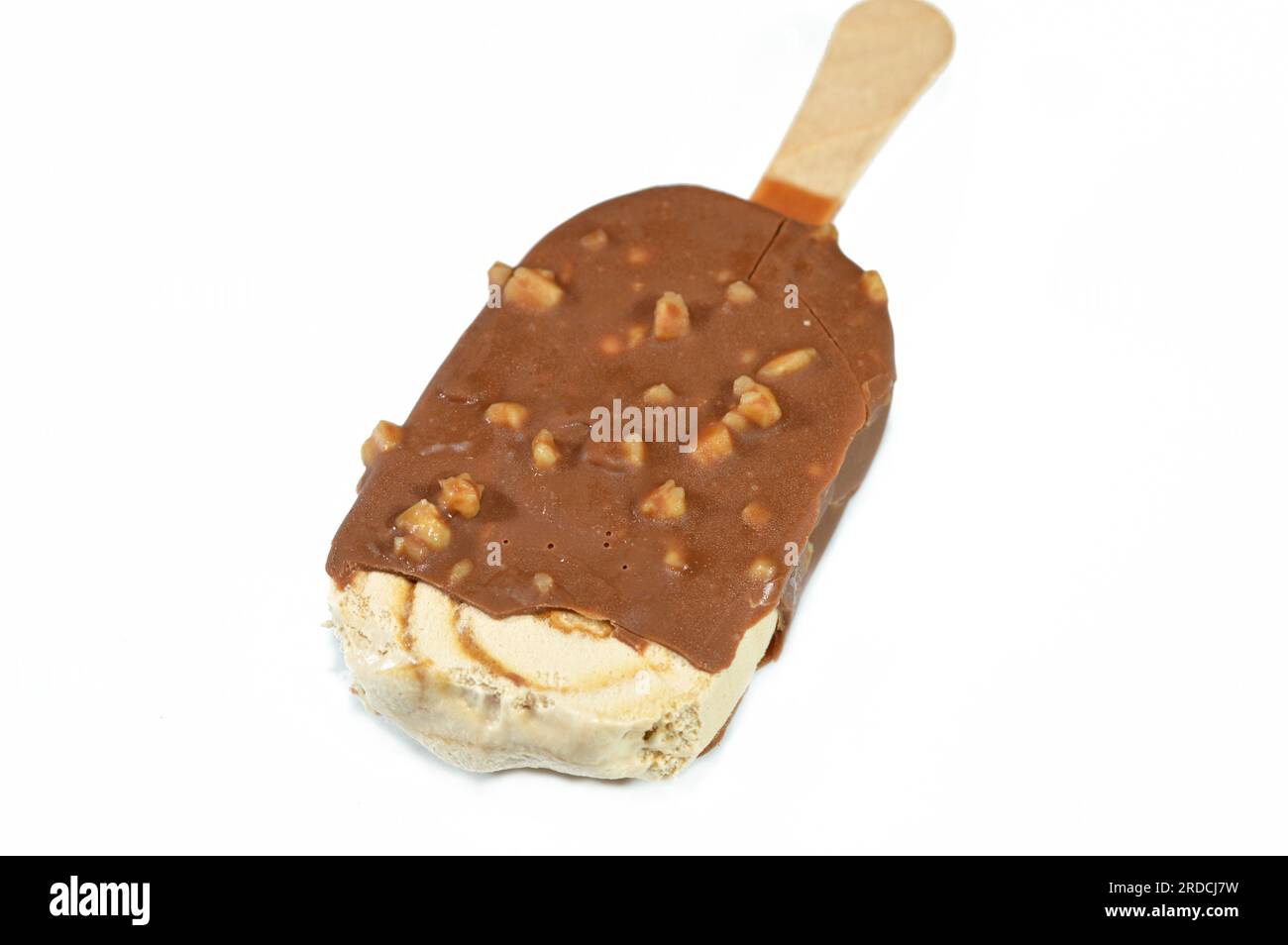 Salted caramel ice cream stick coated and covered with a layer of dark