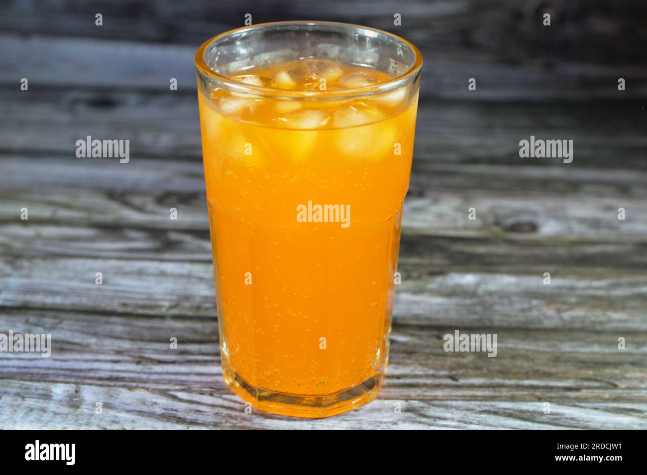 Orange soft drink with ice, orange pop soda, orangeade, carbonated